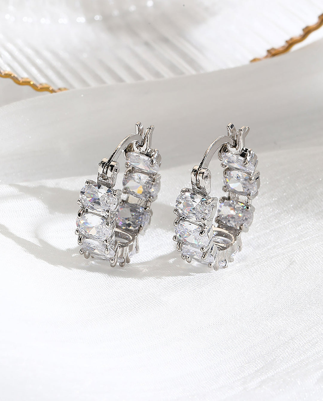 SOLACEOval Cubic Zirconia Full Paved Silver Huggie Hoop Earrings