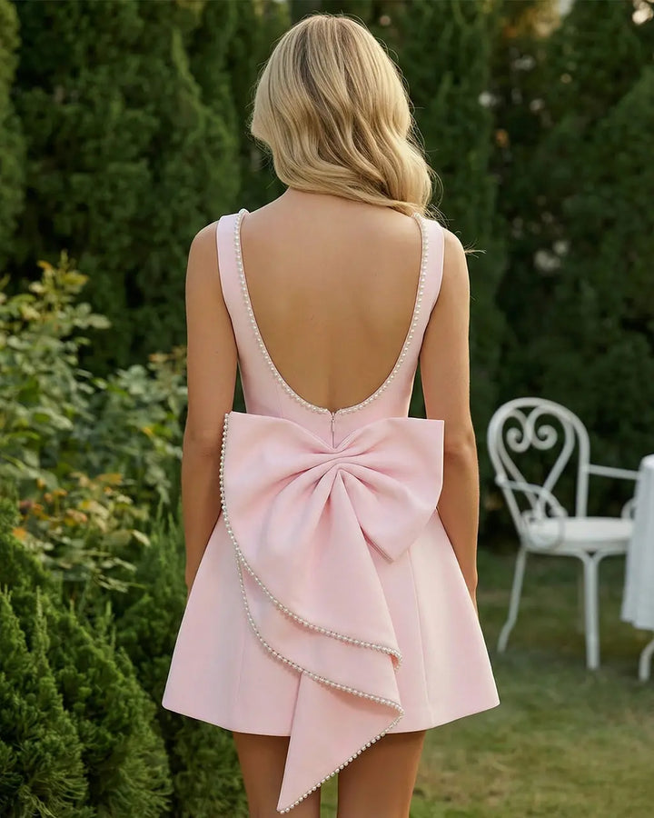 SOLACE  Blush Pink Sleeveless Pearl Trim Bow Back Fit Flare Mini Dress 