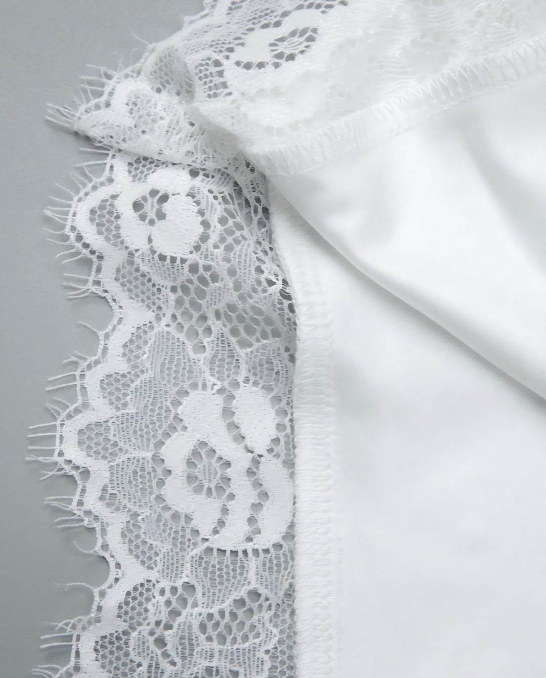 SOLACE  White Off-Shoulder Lace Trimmed Asymmetric Hem Top 