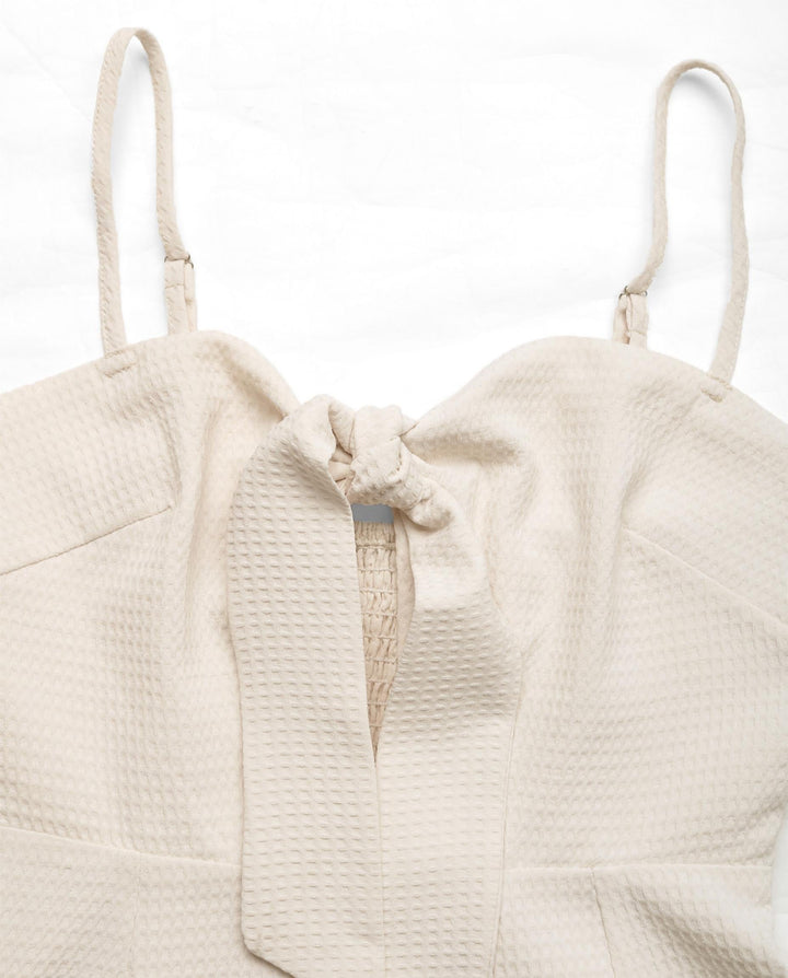 SOLACEWaffle Knit Tie Front Sleeveless Tassel Trim Romper