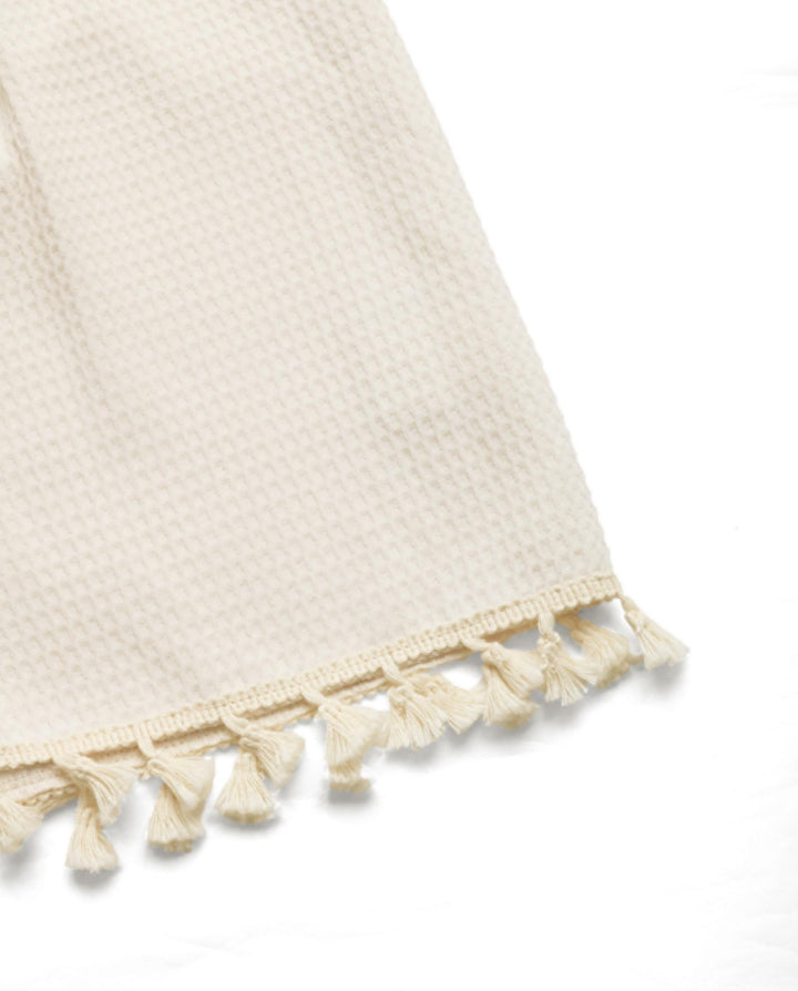 SOLACEWaffle Knit Tie Front Sleeveless Tassel Trim Romper