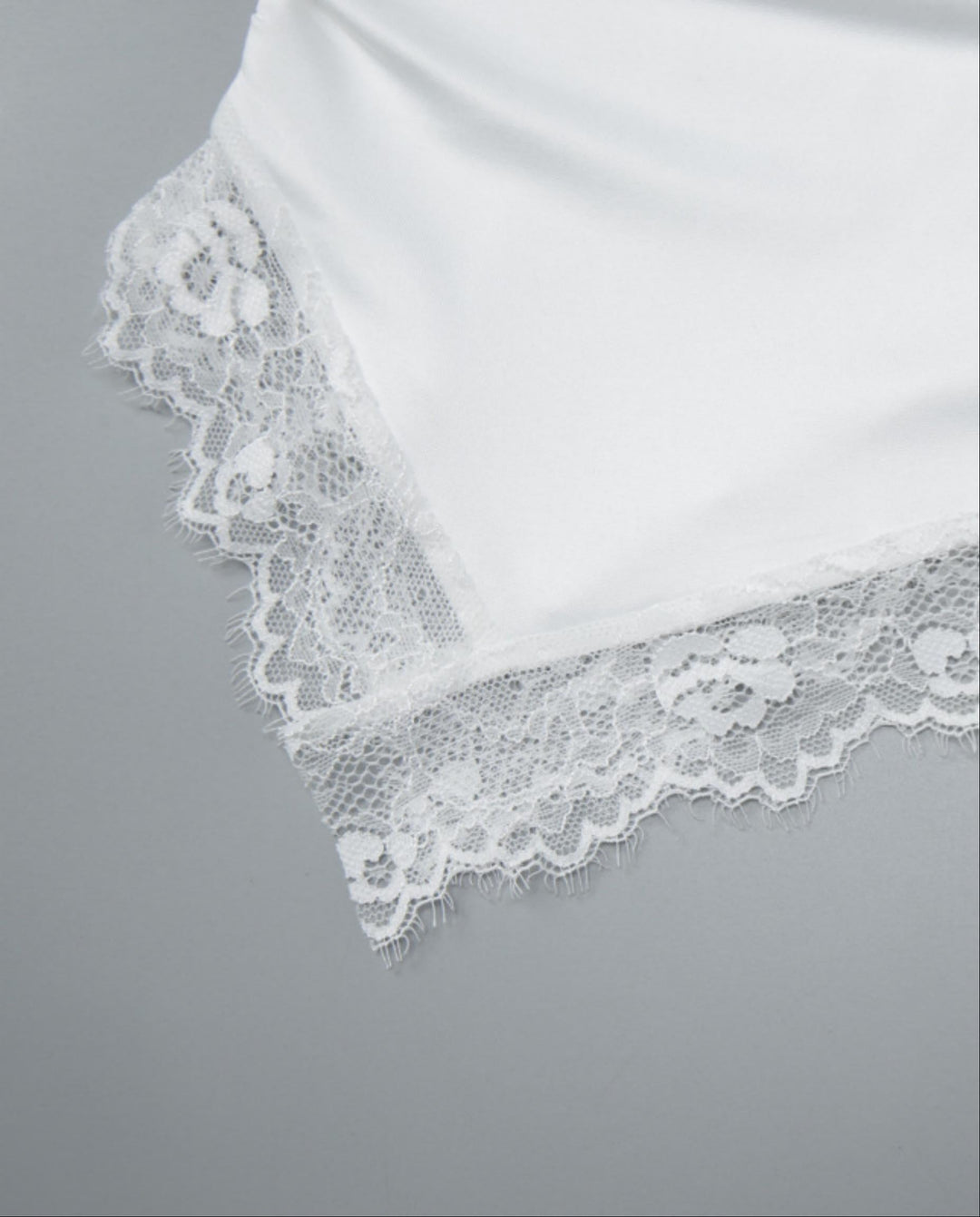 SOLACEWhite Off-Shoulder Lace Trimmed Asymmetric Hem Top